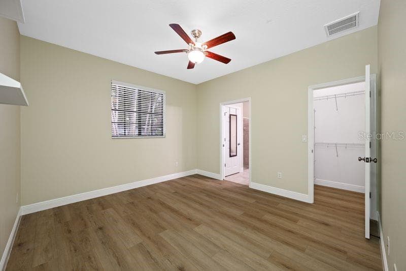 #3 Bedroom with walk-in closet and en-suite bathroom - 114 IRWIN ST E, SAFETY HARBOR