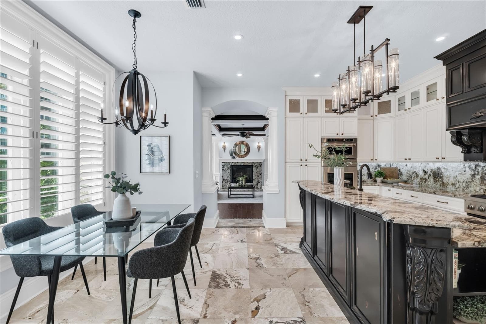Kitchen, breakfast dining leading into Family room - 500 BEACH DR NE, ST PETERSBURG