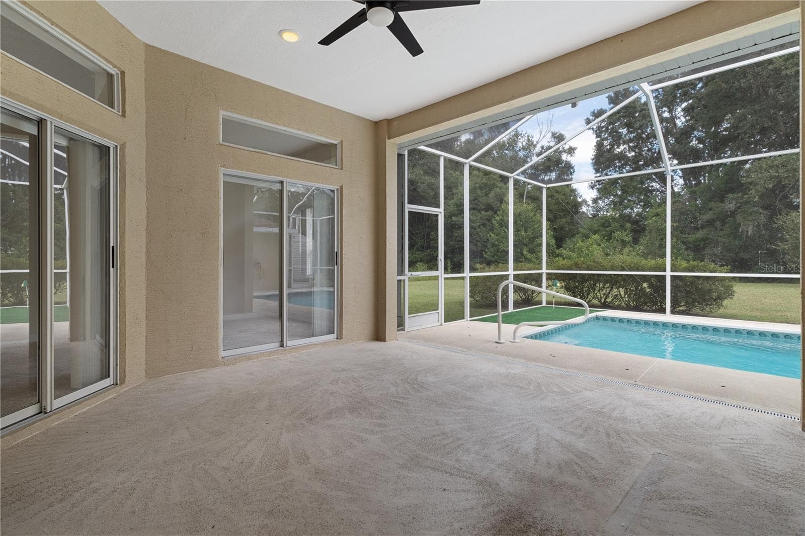 Covered patio by the pool - 24051 MARTIN DR, BROOKSVILLE