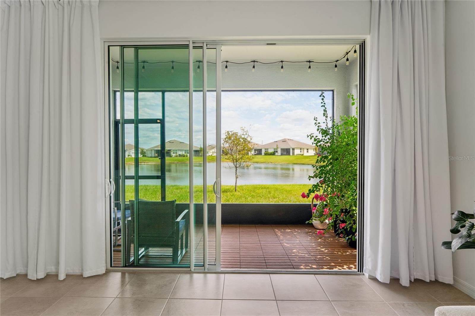 Sliding glass doors leads to lanai/patio - 8580 BOLD CYPRESS LN, WESLEY CHAPEL