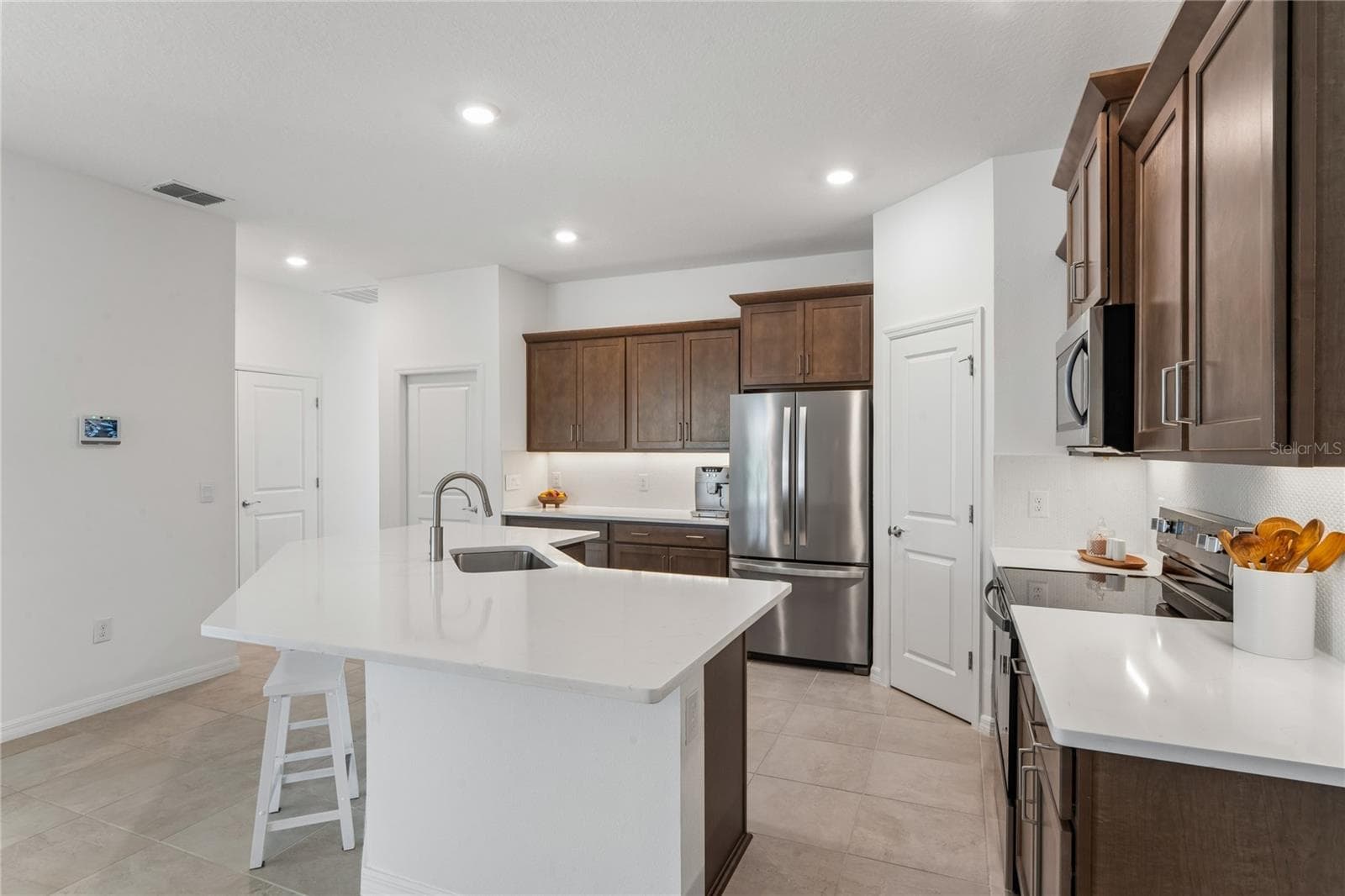 Kitchen view from Dining Room - 8580 BOLD CYPRESS LN, WESLEY CHAPEL