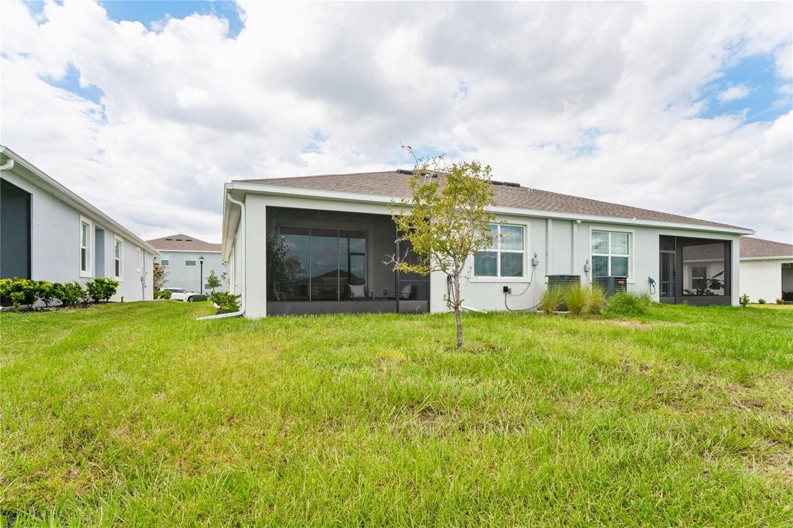 View of home from retention pond - 8580 BOLD CYPRESS LN, WESLEY CHAPEL