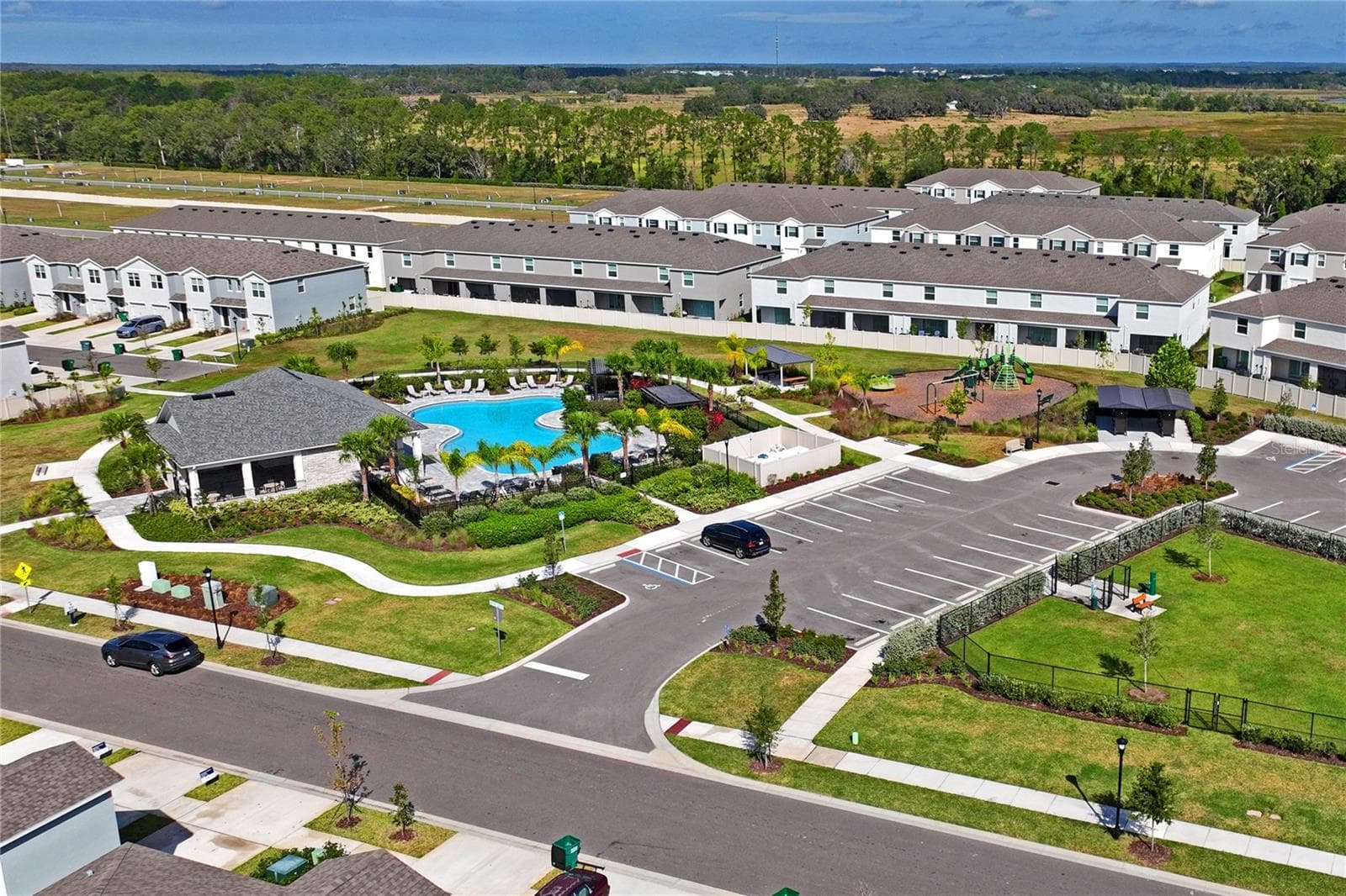 Drone view of community amenity parking - 8580 BOLD CYPRESS LN, WESLEY CHAPEL