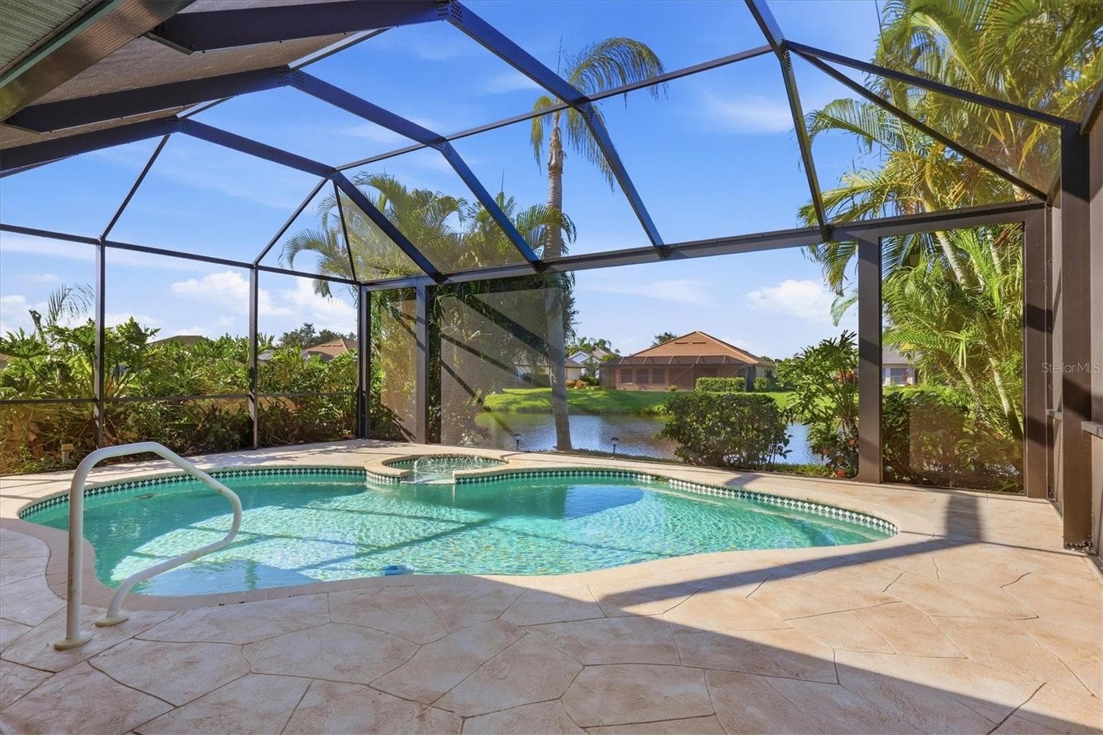 Pool overlooking lake - 3200 BAY RIDGE WAY, PORT CHARLOTTE
