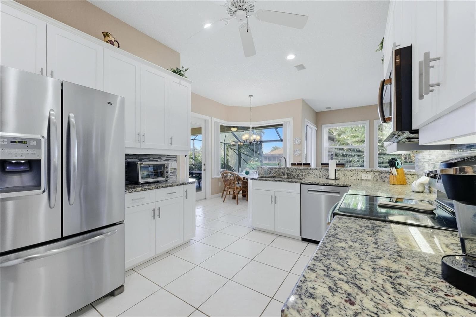 Kitchen-Breakfast Nook overlook pool & lake - 3200 BAY RIDGE WAY, PORT CHARLOTTE