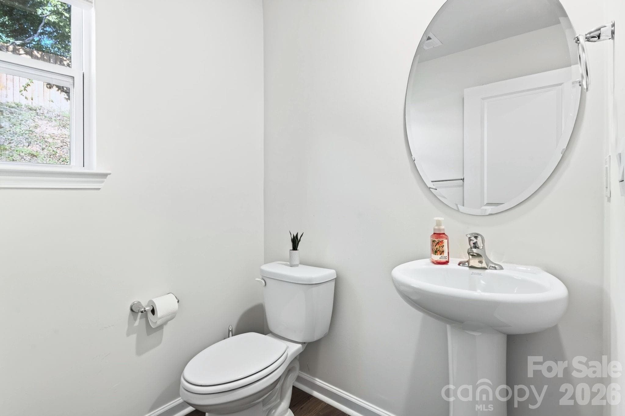 Main-Level Half Bath off Laundry Room - 15 Virginia Commons Drive, Arden
