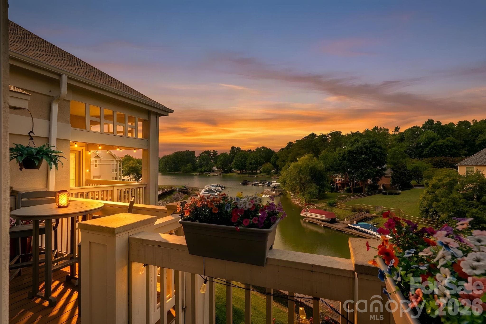 Patio view of Lake Norman at sunset - 103 Pier 33 Drive, Mooresville