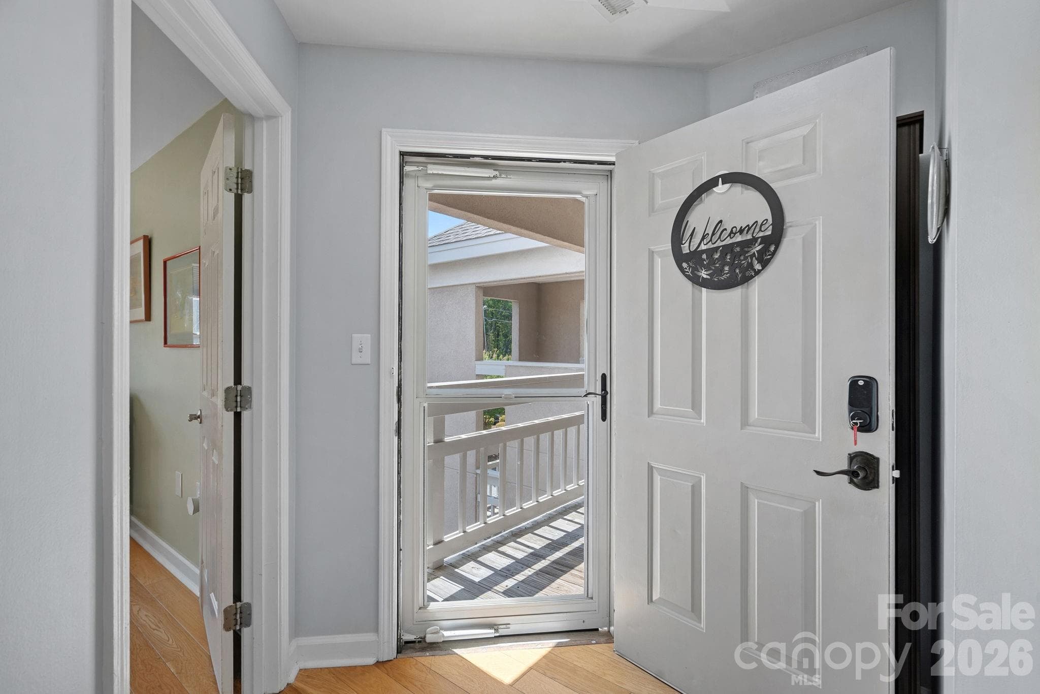 Front entrance, storm glass door to let the sunlight in! - 103 Pier 33 Drive, Mooresville