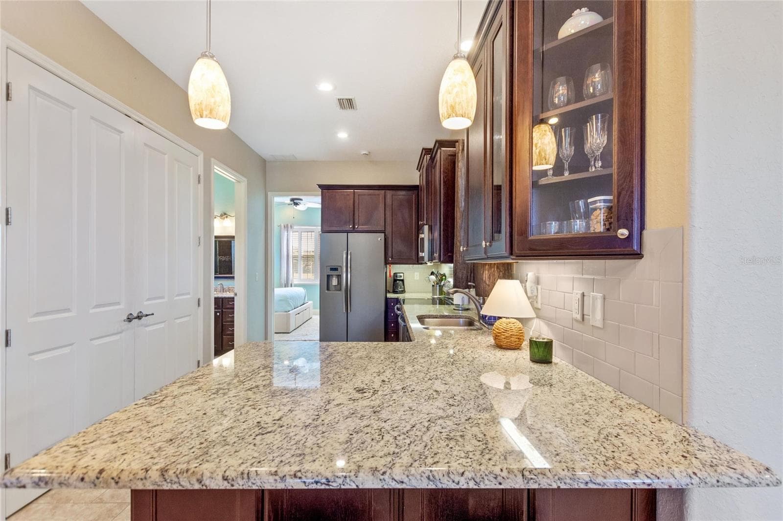 Kitchen with washer and dryer closet - 1030 CROSS ROADS DR, POLK CITY