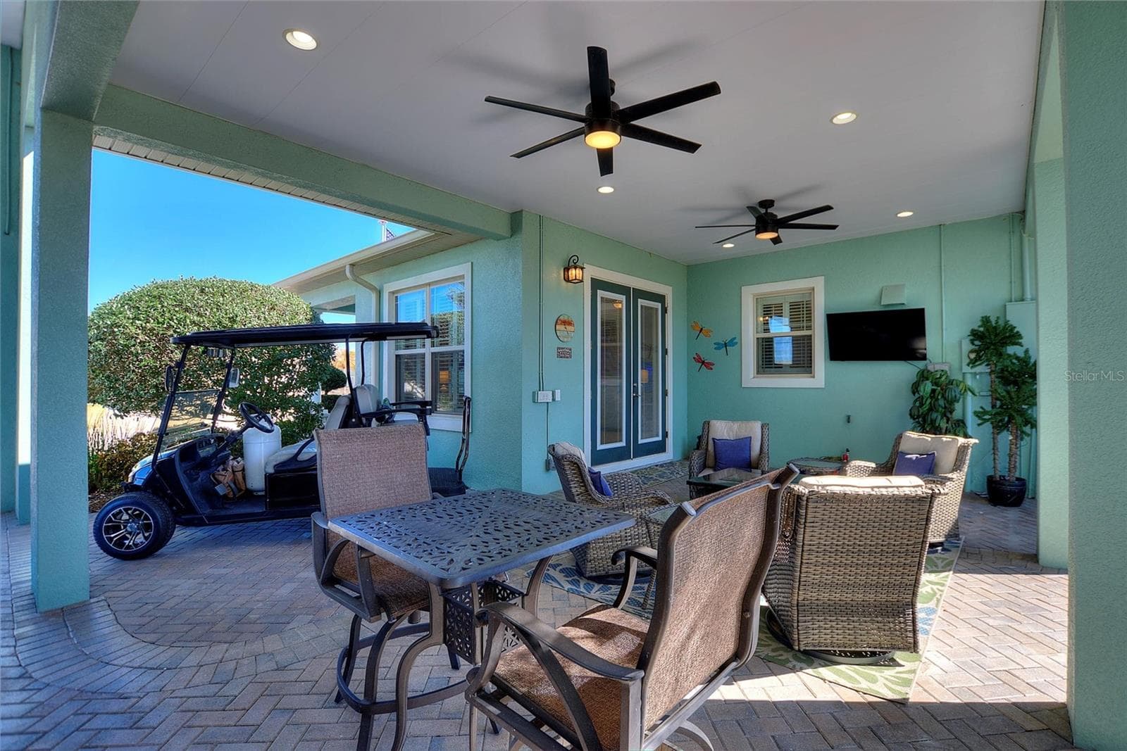 16x24 breezeway with ceiling fans facing front of the house - 1030 CROSS ROADS DR, POLK CITY
