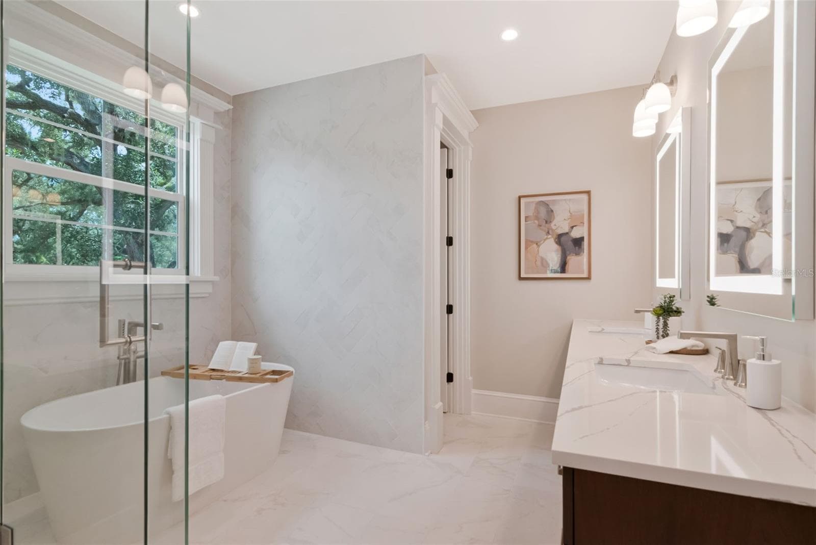 Dual vanities, glass shower, and tub in primary bath - 4706 W SAN JOSE ST, TAMPA