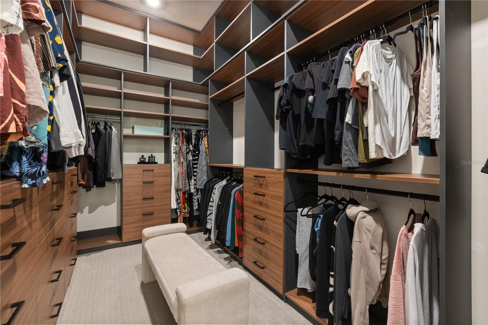 One set of two closets in master suite with custom cabinetry - 4348 SUNSET PRESERVE BLVD, ORLANDO