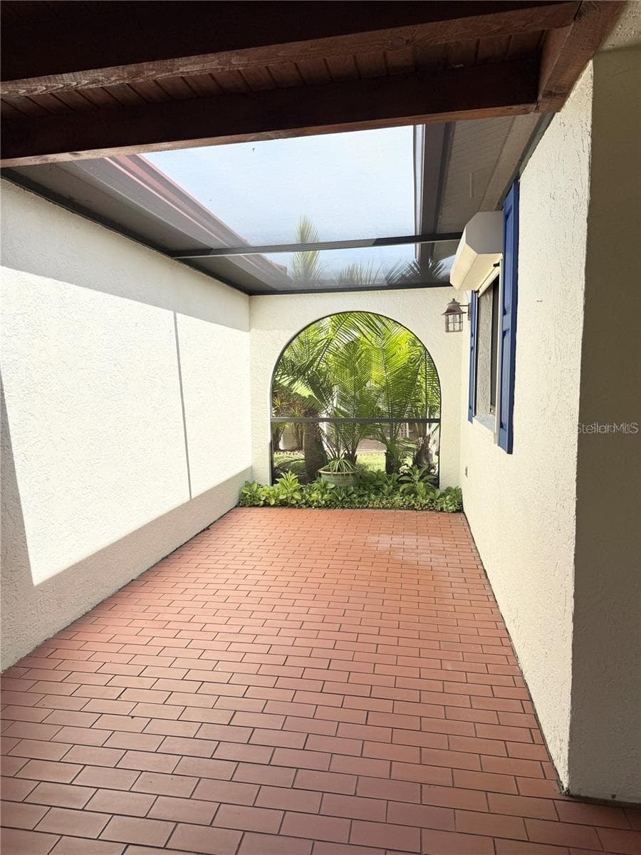 Covered courtyard connects the garage and home entry - 1640 ATARES DR #16, PUNTA GORDA