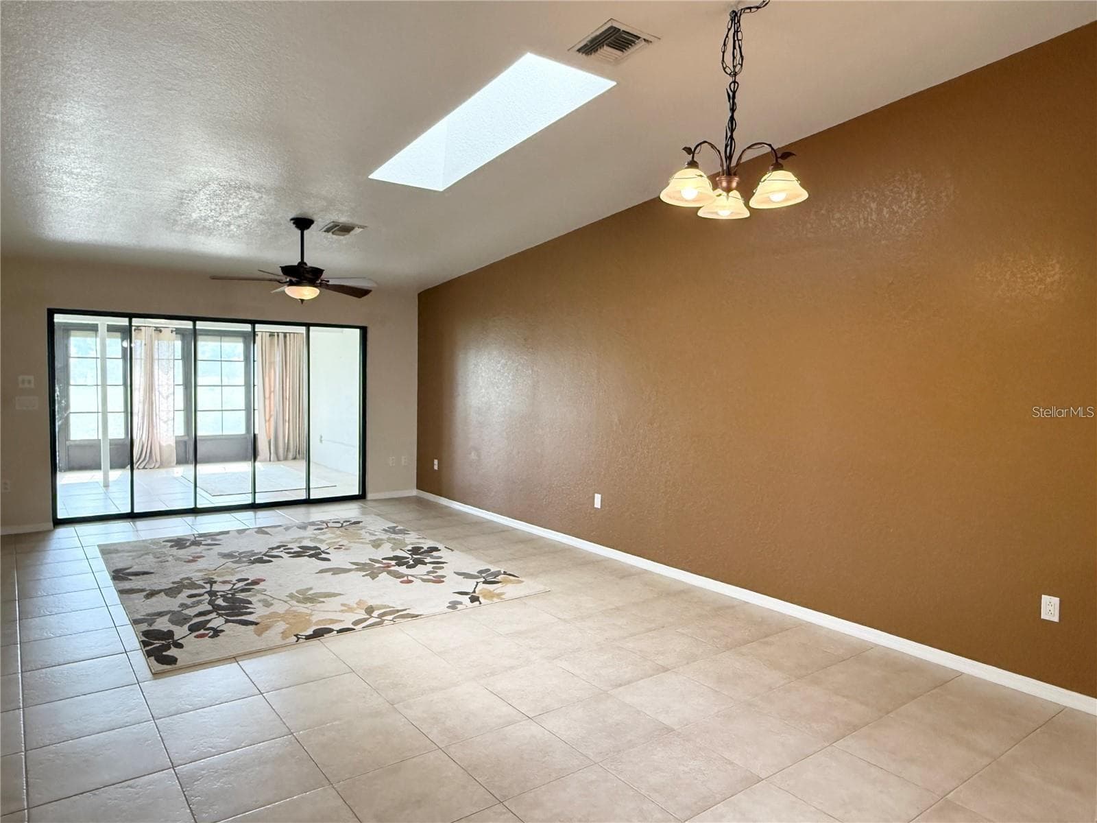 Open floor plan easily flows from dining room to living space and Florida room - 1640 ATARES DR #16, PUNTA GORDA