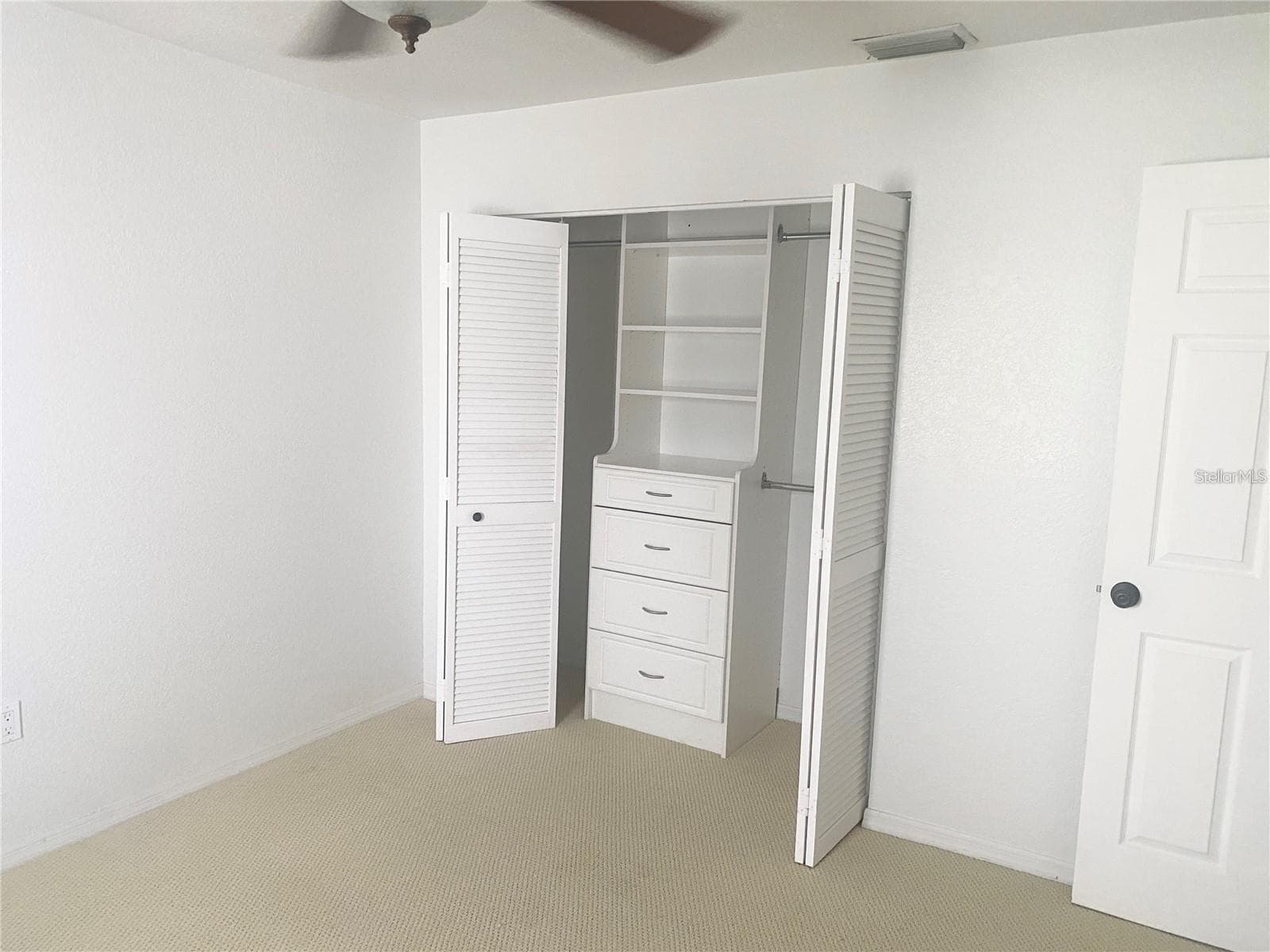 Guest suite closet - 1640 ATARES DR #16, PUNTA GORDA