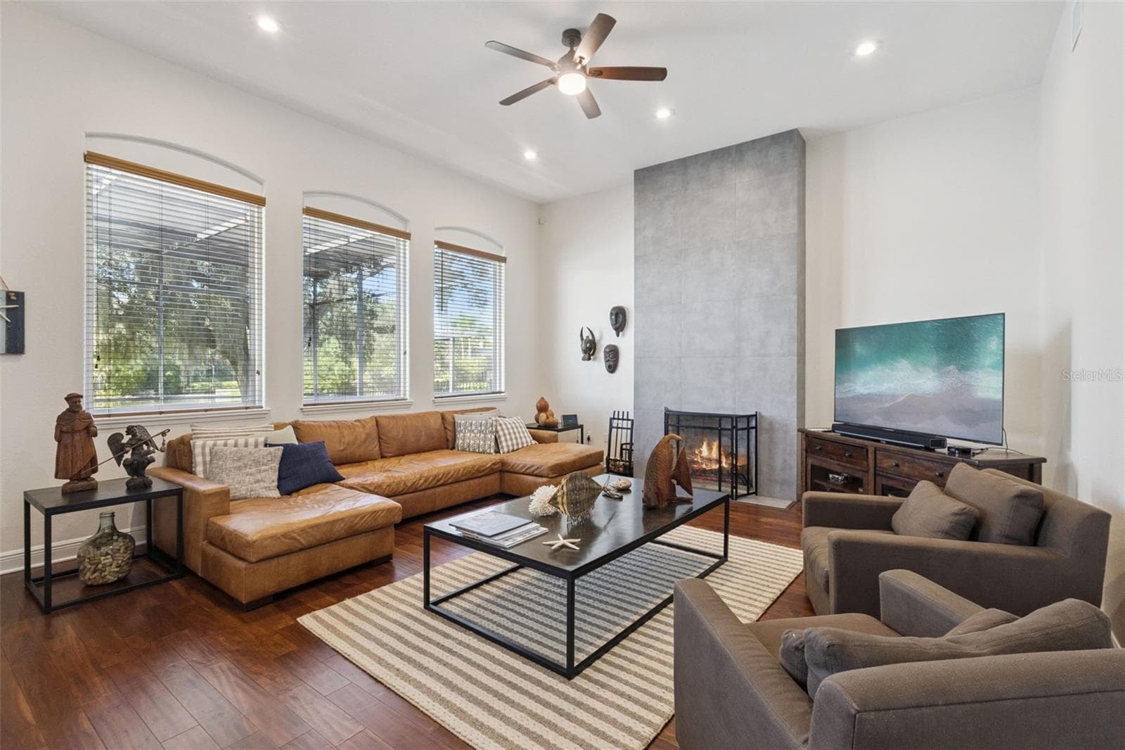 Family room with warming fireplace. - 3832 HUNTERS ISLE DR, ORLANDO