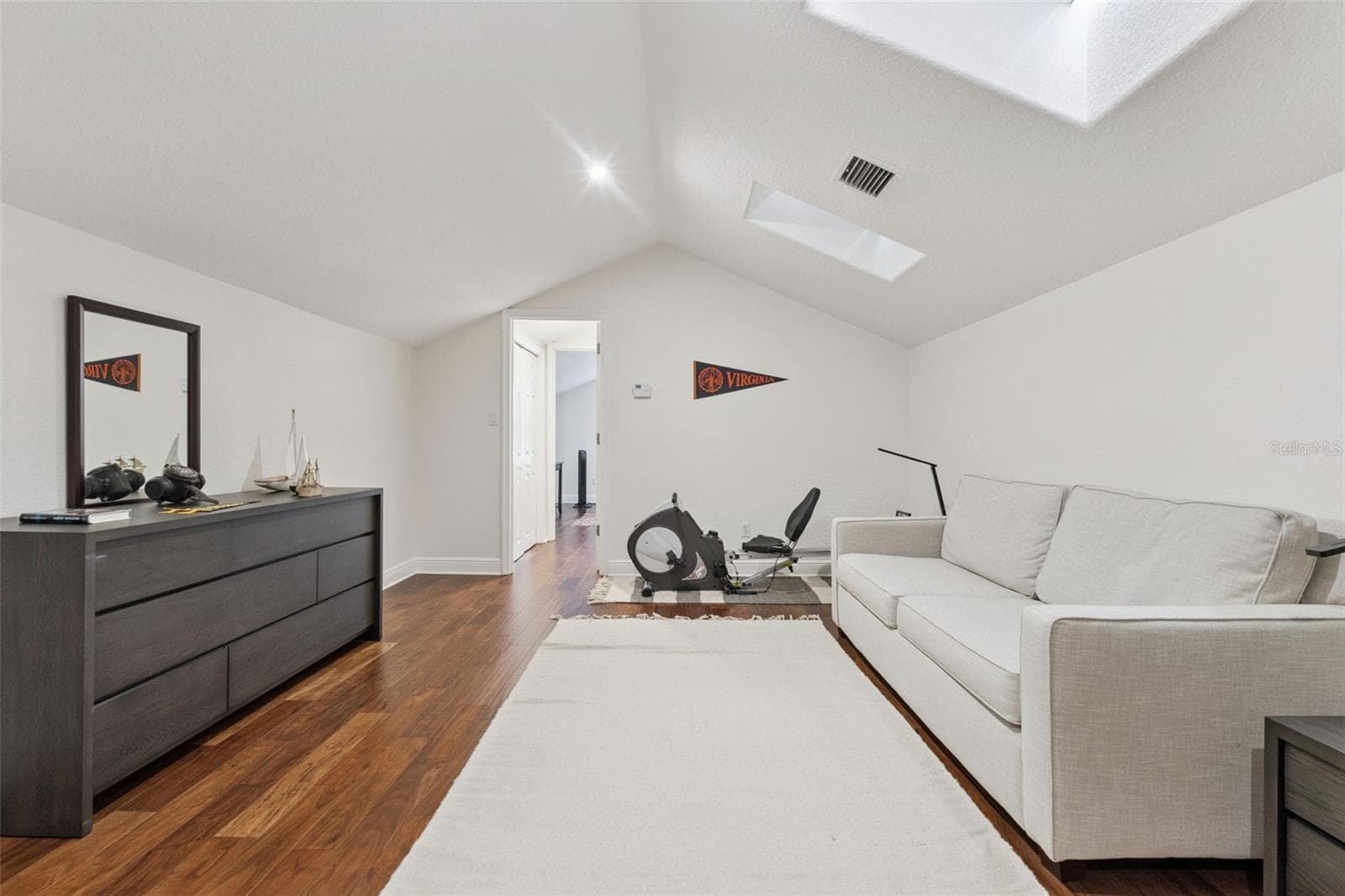 Second floor private bedroom suite with living room, bath and bedroom with skylights. - 3832 HUNTERS ISLE DR, ORLANDO