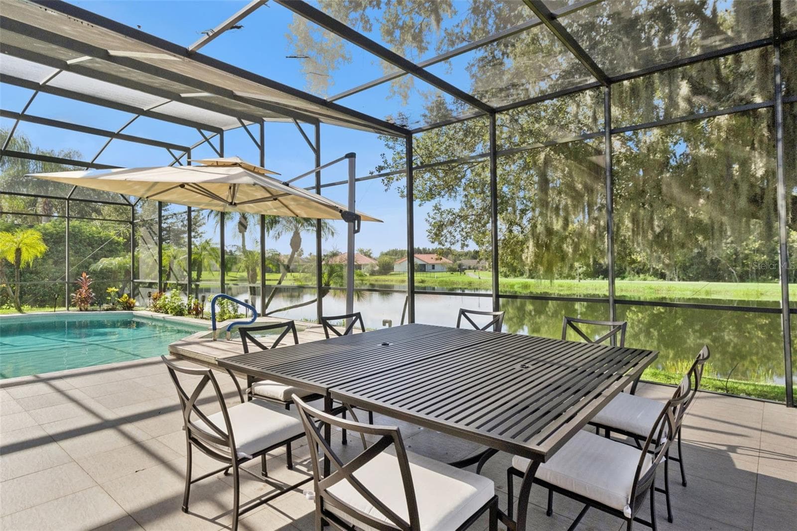 Oversized pool/spa area with screen enclosure - View 4. - 3832 HUNTERS ISLE DR, ORLANDO