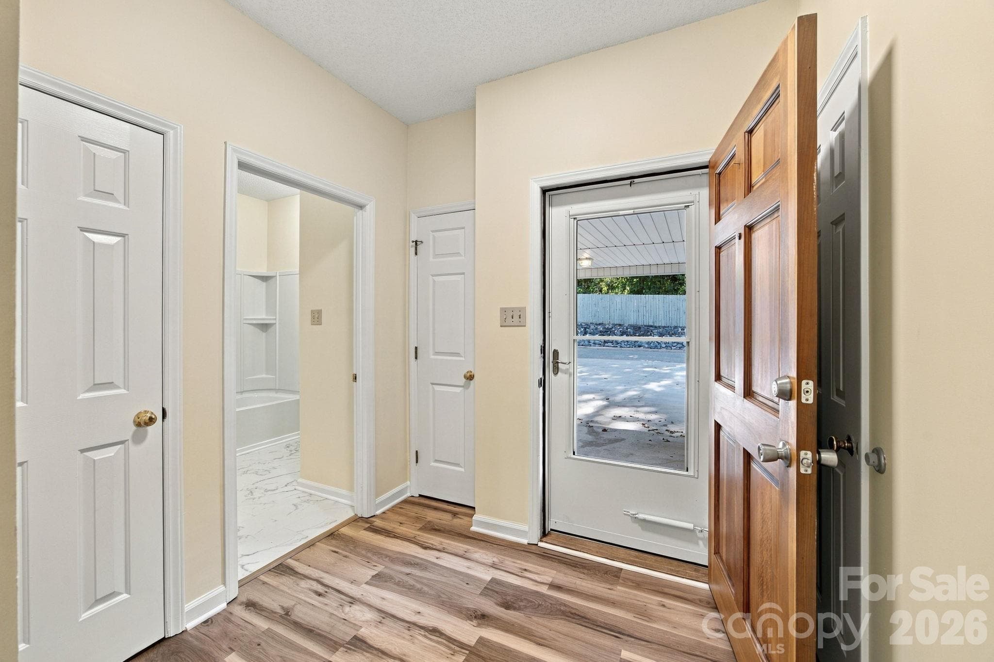 Front entry hallway and bathroom entrance - 19838 Oak Leaf Circle, Cornelius