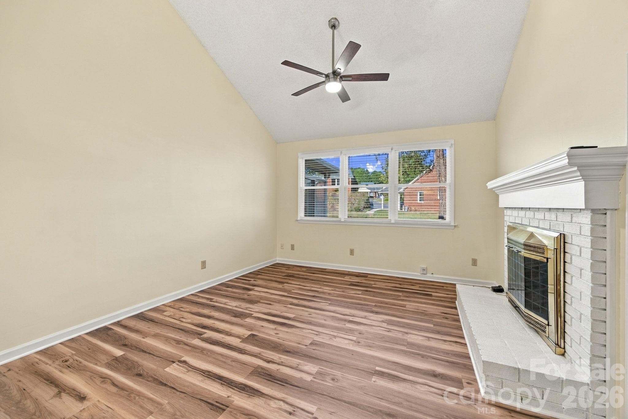 Living room with vaulted ceiling and gas fireplace - 19838 Oak Leaf Circle, Cornelius