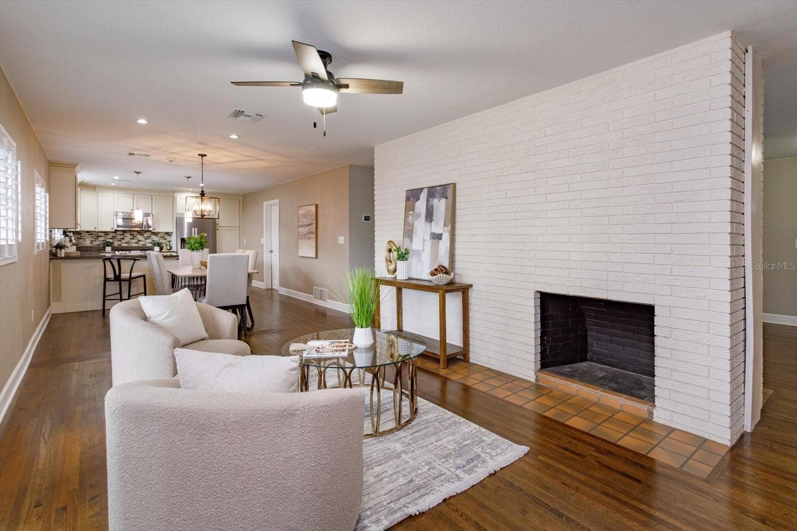 Family room with double-sided fireplace - 1060 GREGORY DR, MAITLAND