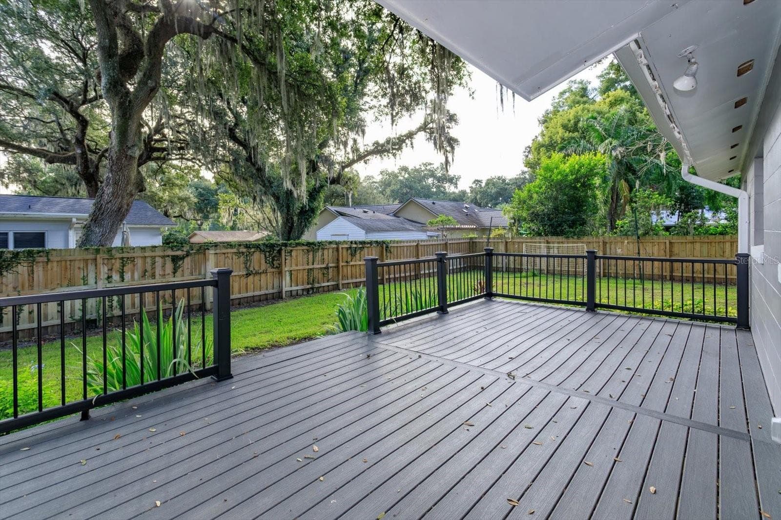 Rear deck overlooks the back yard - 1060 GREGORY DR, MAITLAND