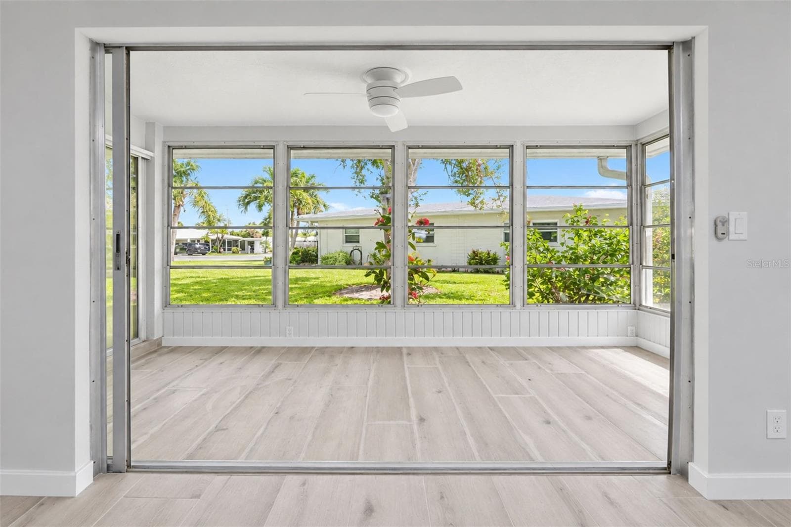 Sliding glass doors combine the living and 4 season room. - 206 BRIGANTINE WAY #206, NOKOMIS