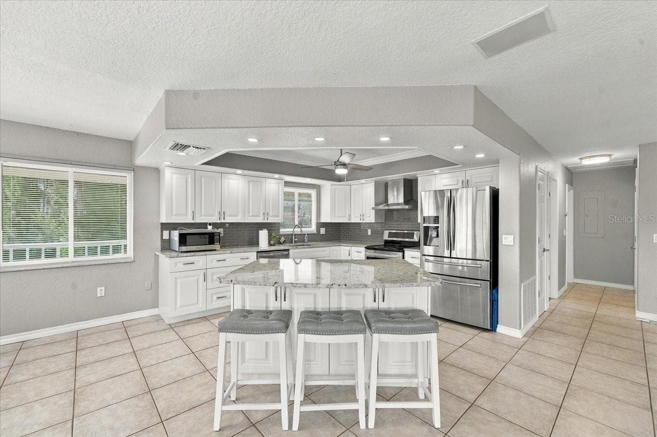 Kitchen with stone countertops - 6744 SEAVIEW BLVD, HUDSON