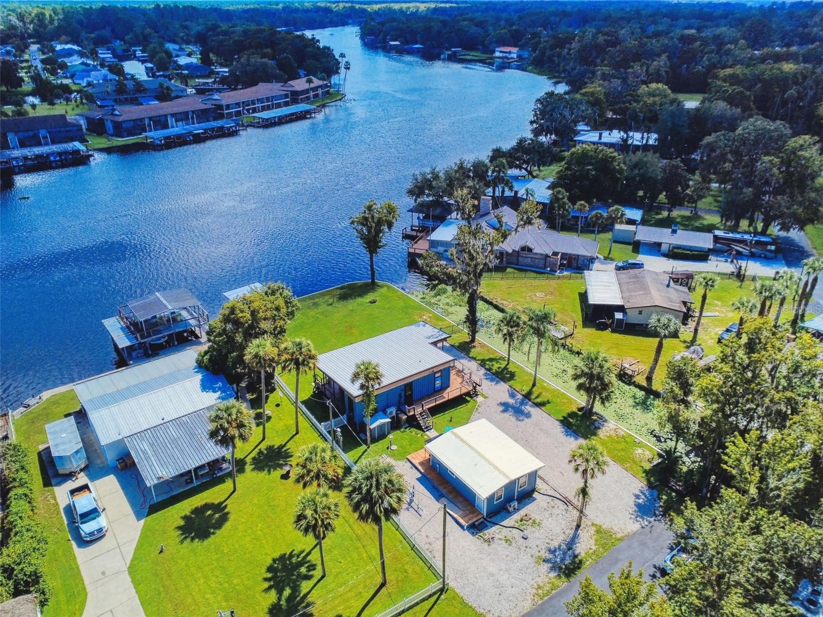 high aerial of property and homes - 56108 SAWGRASS RD, ASTOR