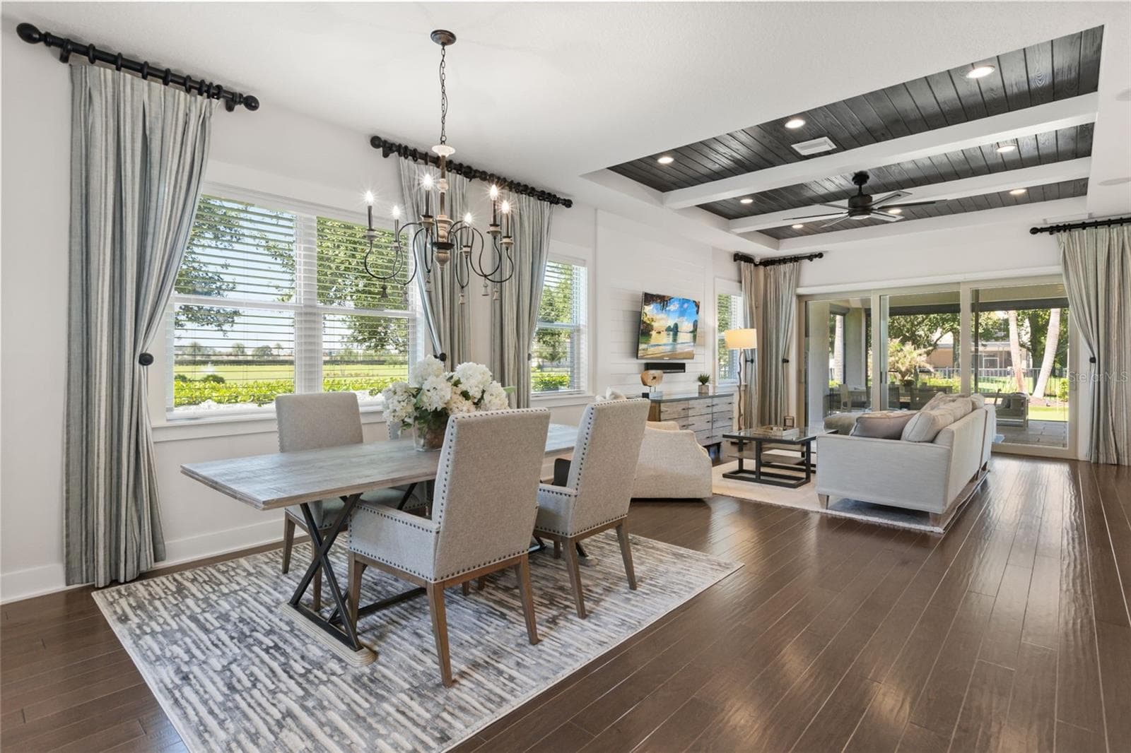 Green space across all living areas inside and out. The flood of natural light highlights the unique design upgrades to this home. - 8836 LAKESHORE POINTE DR, WINTER GARDEN
