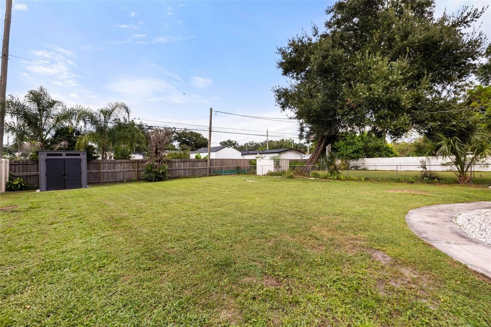 Expansive fenced in backyard with a storage shed - 3105 PICKFAIR ST, ORLANDO
