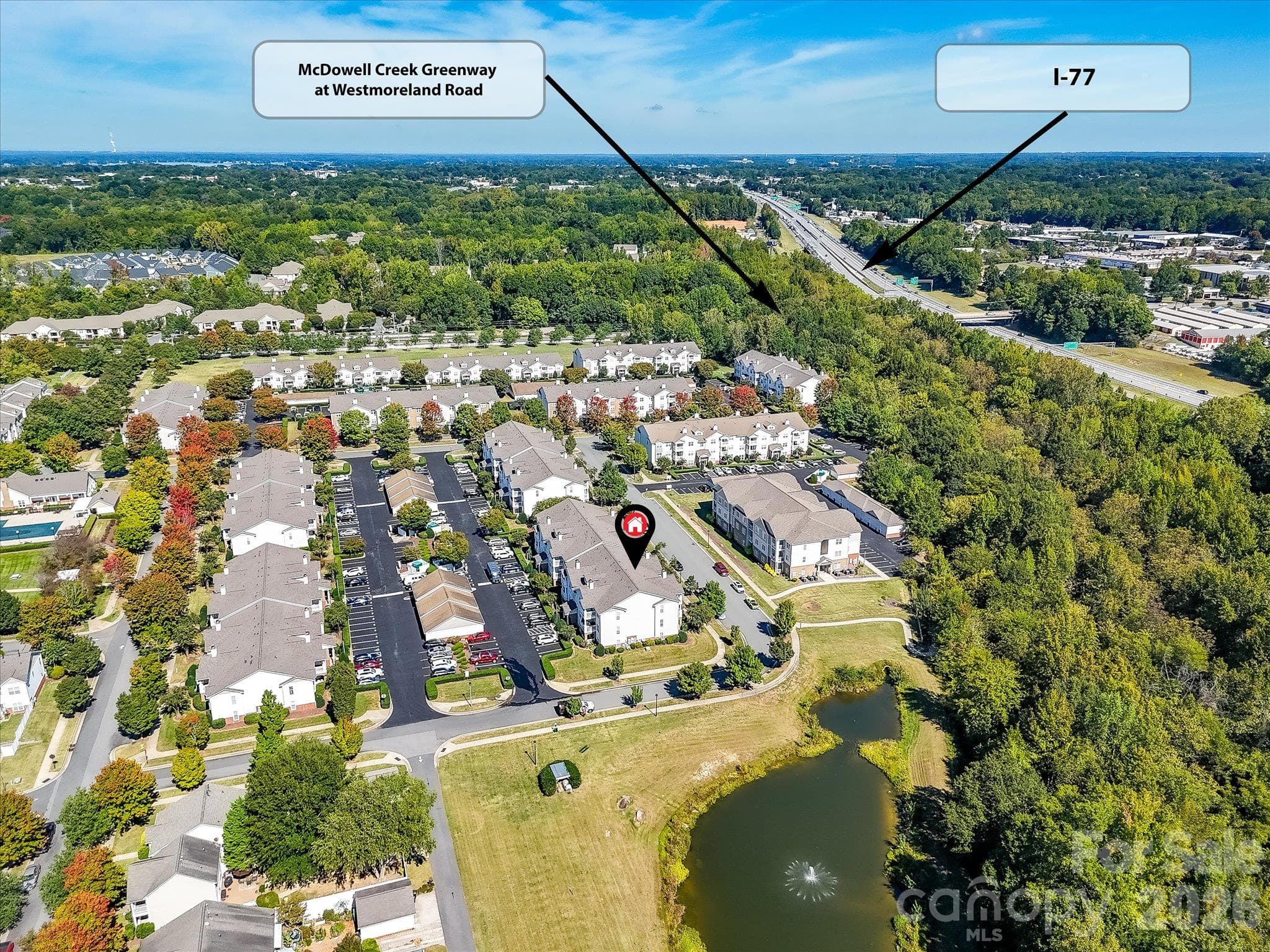 Aerial view highlights the condo’s convenient proximity to McDowell Creek Greenway, I-77, nearby recreation, and surrounding community amenities. - 9031 Mcdowell Creek Court, Cornelius
