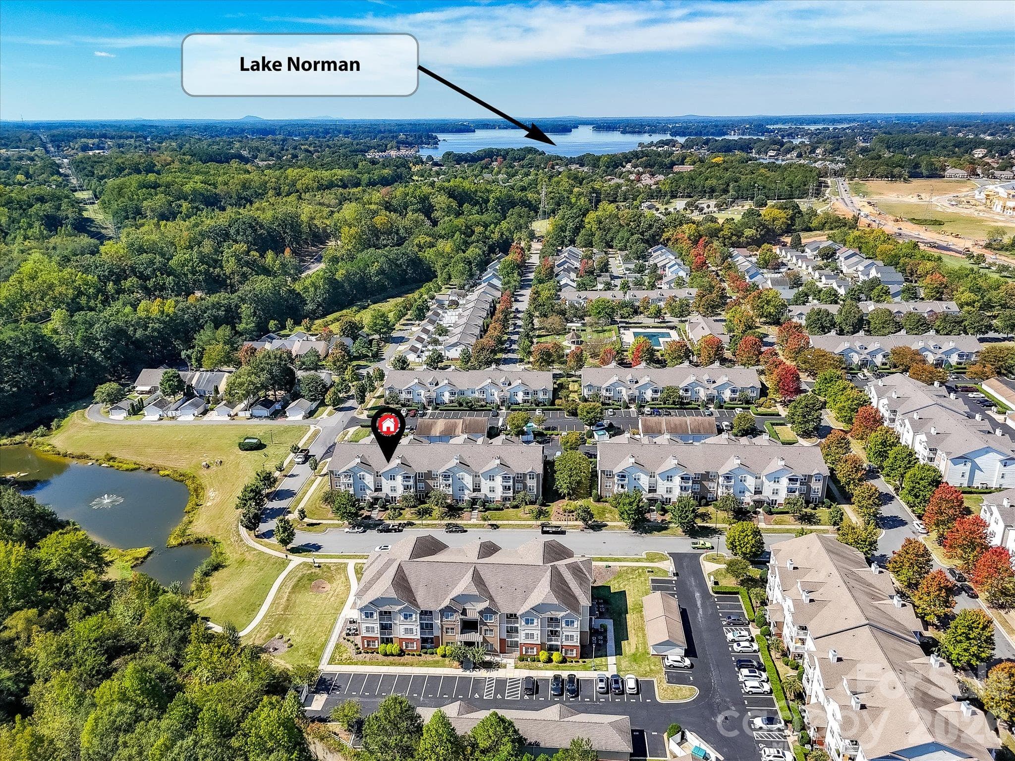 Aerial view highlights the condo’s convenient proximity to Lake Norman, offering easy access to the area’s waterfront recreation, dining, and lifestyle amenities. - 9031 Mcdowell Creek Court, Cornelius