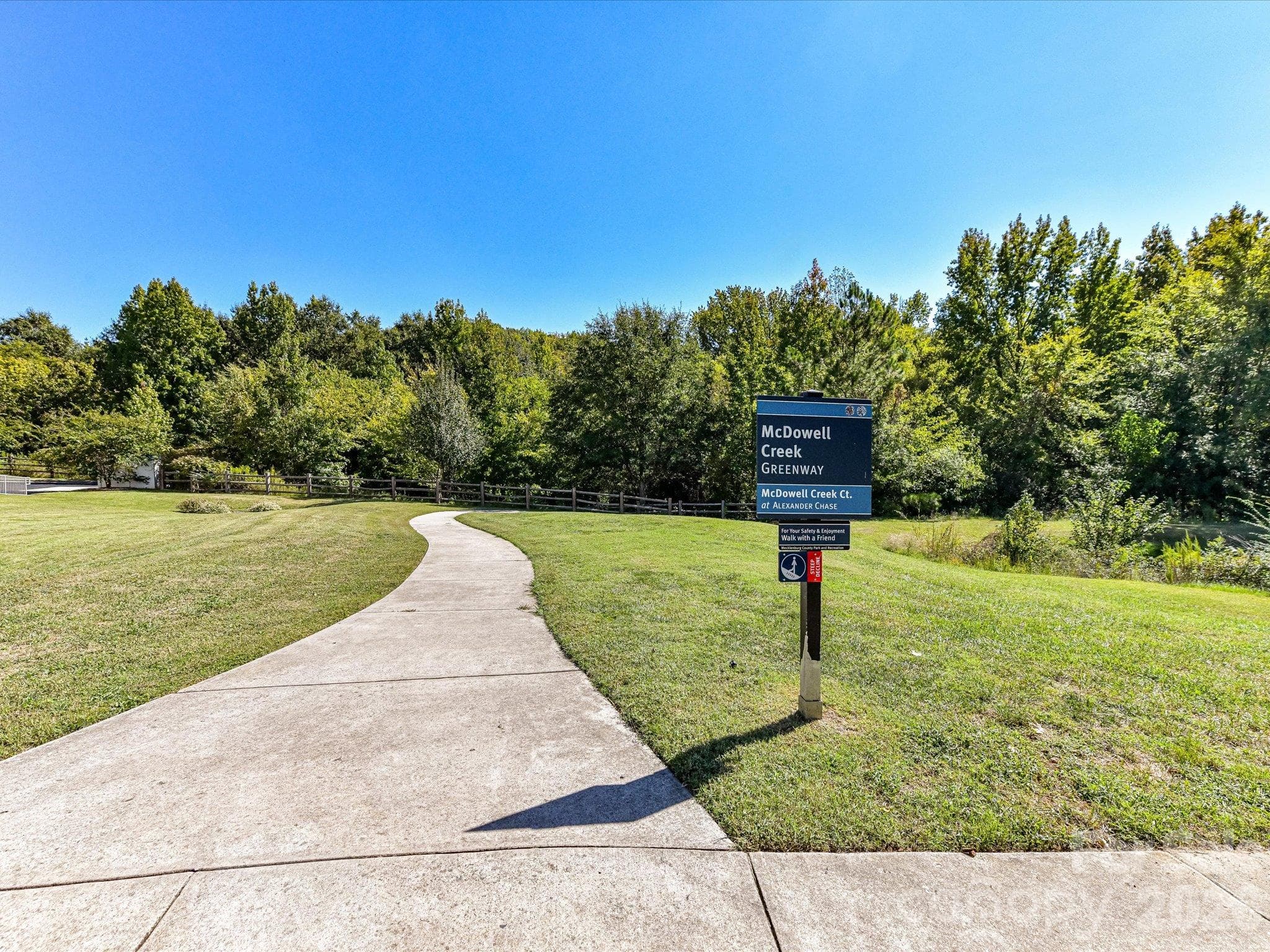Convenient access to the McDowell Creek Greenway offers a scenic paved trail surrounded by green space for walking, jogging, and outdoor recreation. - 9031 Mcdowell Creek Court, Cornelius