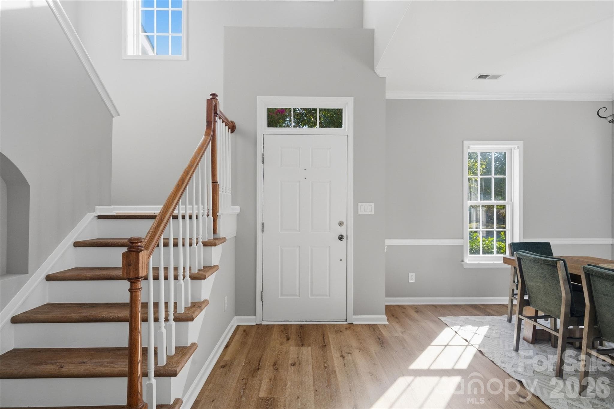 Two-story foyer filled with abundant natural light - 11709 Borchetta Drive, Charlotte