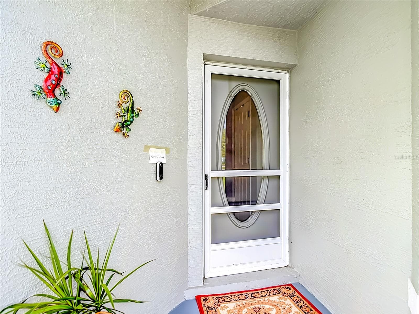 The entry way is screened along with an additional screen at the front door. - 13428 NORMAN CIR, HUDSON