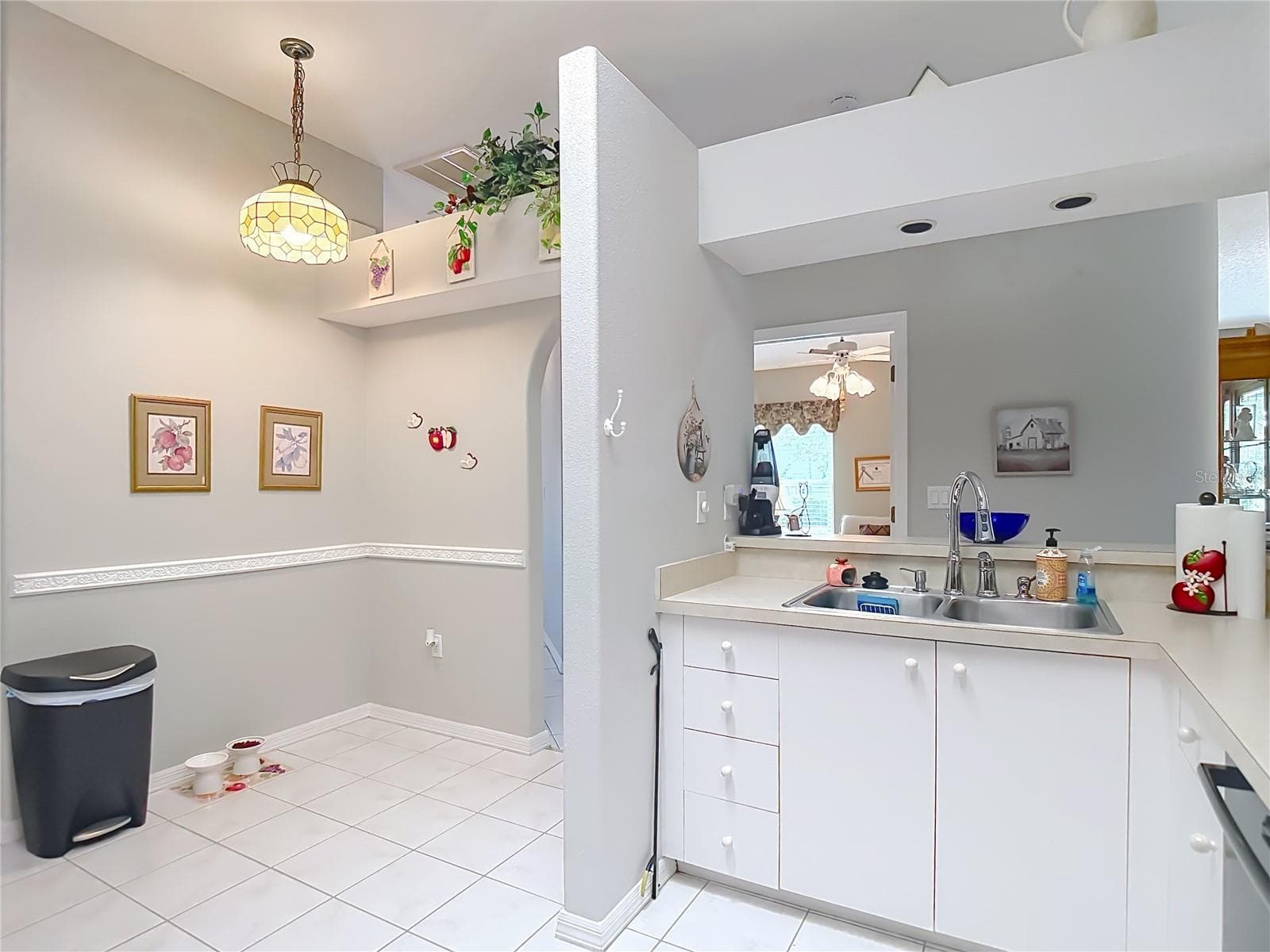 The kitchen also has a sky light for some natural sunlight. To finish the kitchen off a small dinette table would be beneficial for eating in the kitchen - 13428 NORMAN CIR, HUDSON