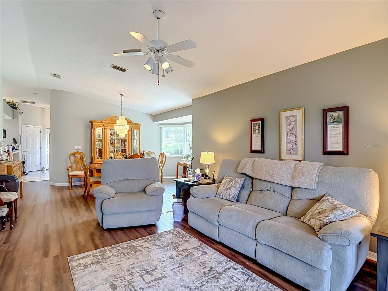 The living room is at the back of the unit where you can sit peacefully with a book, listen to musis or watch your favorite television shows. - 13428 NORMAN CIR, HUDSON