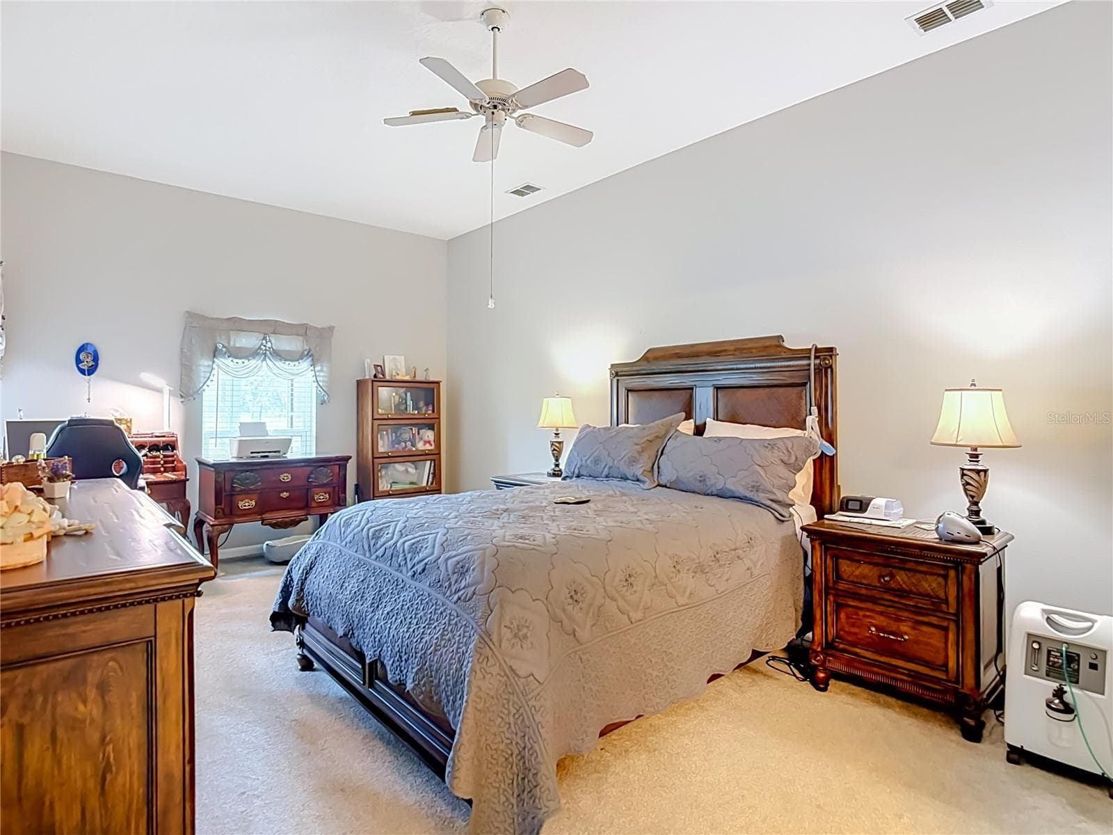 The primary bedroom is a great size (12'x20') with plenty of artifical light from the window and double door out to the lanai / patio. - 13428 NORMAN CIR, HUDSON