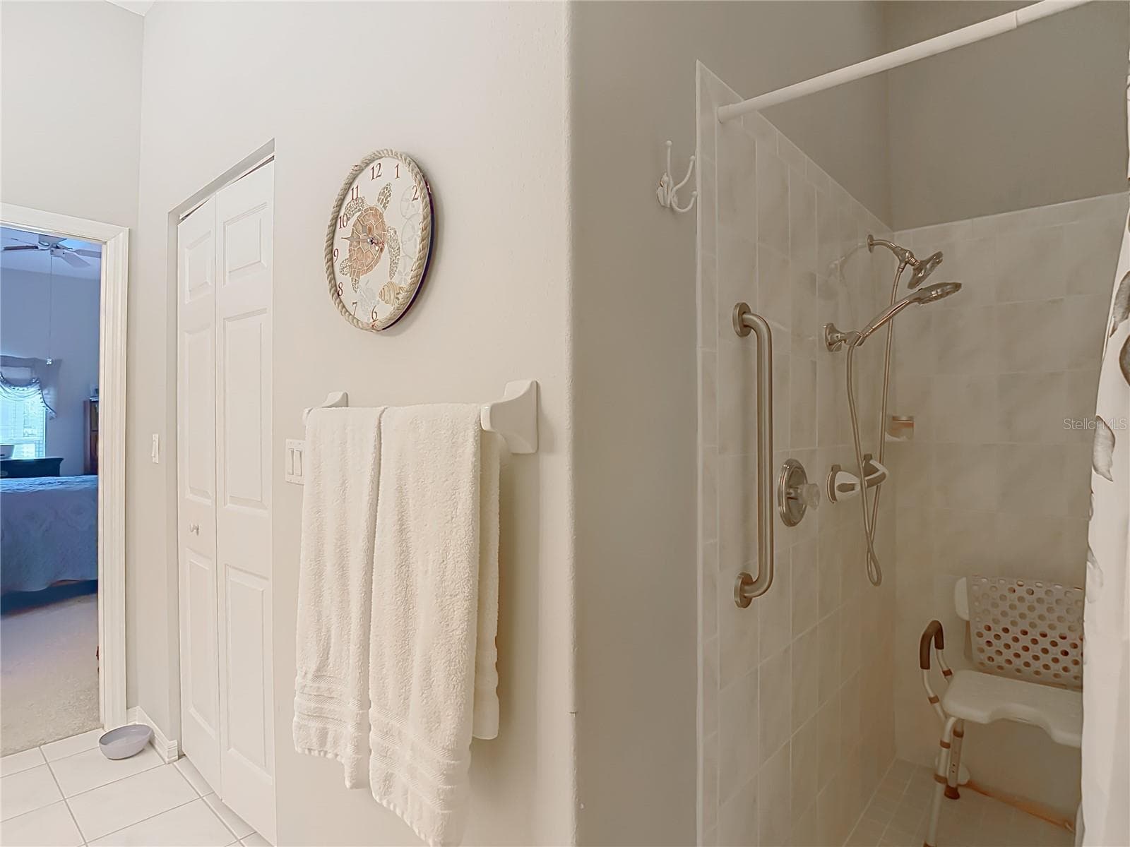 Walk in shower has a safety bar in place - 13428 NORMAN CIR, HUDSON