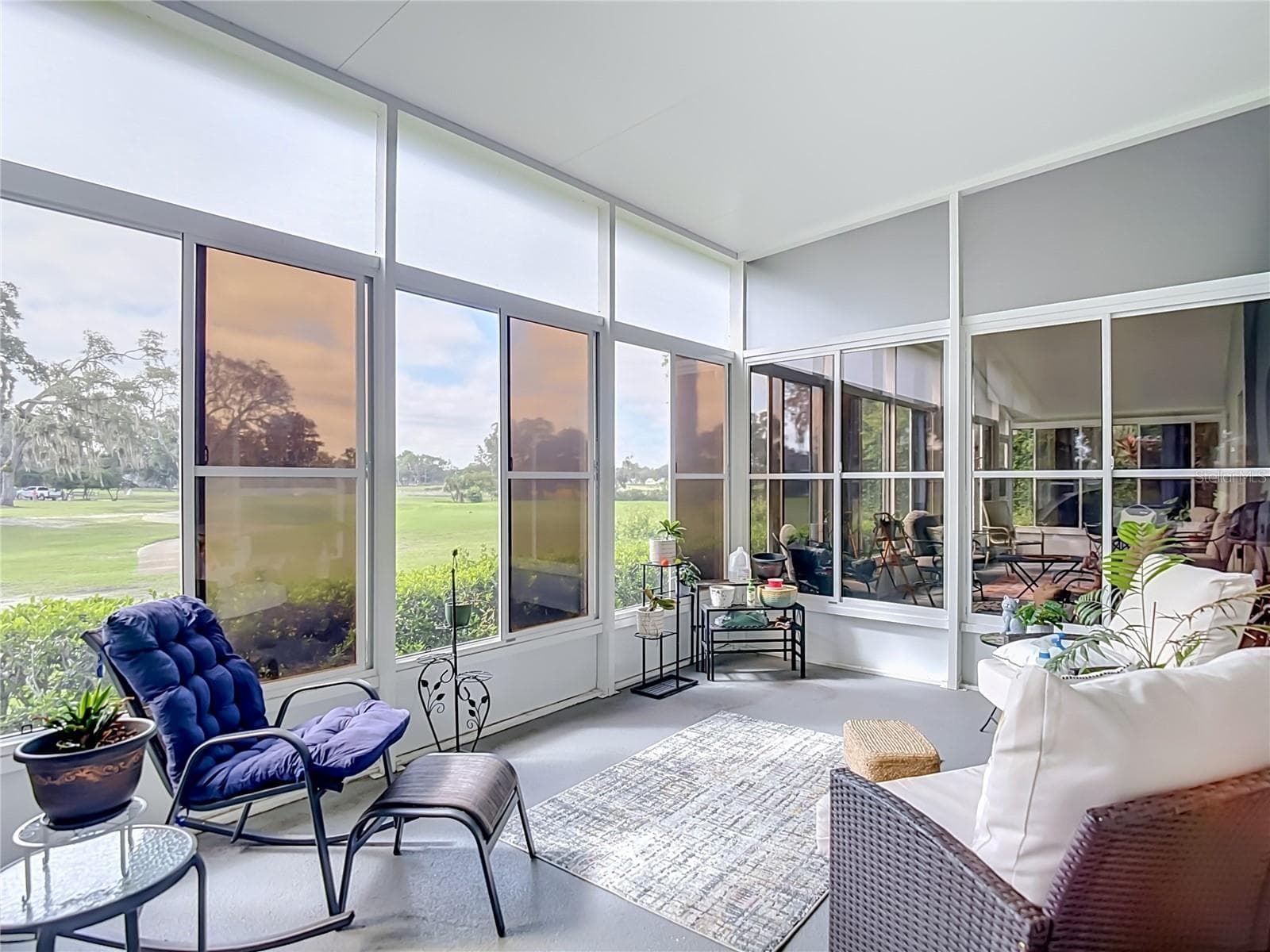 THe lanai patio is completly screen with vinyl sliding windows as well for privacy or to keep the rains from putting a damper on your plans for the day. The entire area is alsoroofed. What a great way to sit and watch the golfers on the 10th fairway. - 13428 NORMAN CIR, HUDSON