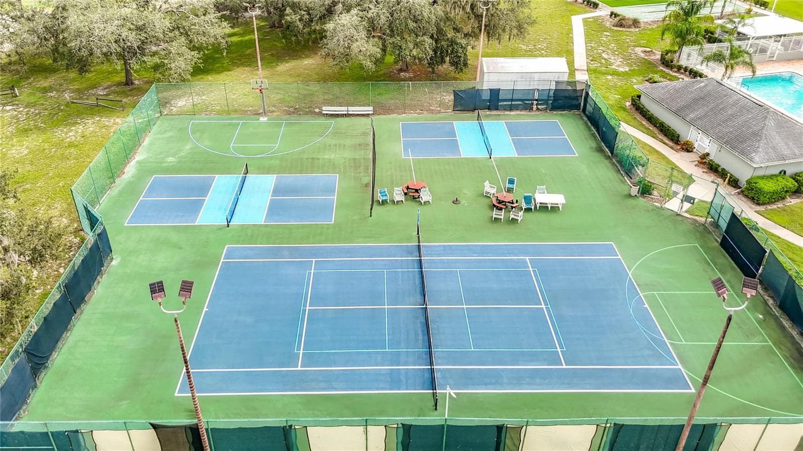 Pickle ball, tennis and basket ball courts are located ina fenced in area. - 13428 NORMAN CIR, HUDSON