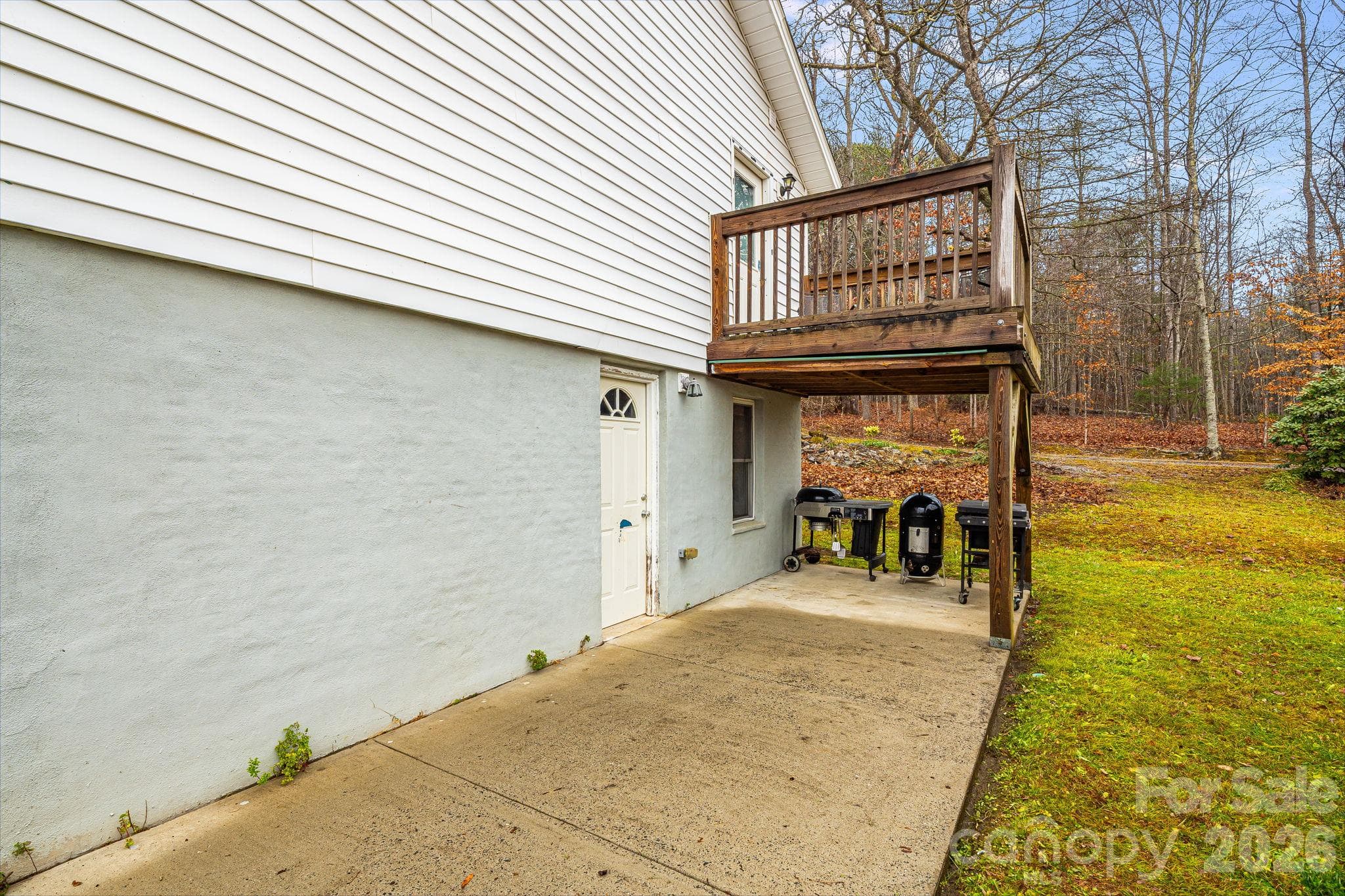 Back of home, Basement access door - 195 Whitmire Road, Brevard