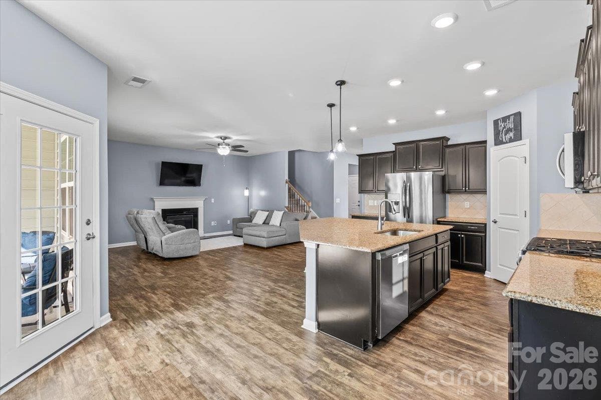 Kitchen opens to living room - 2003 Harvest Time Lane, Waxhaw