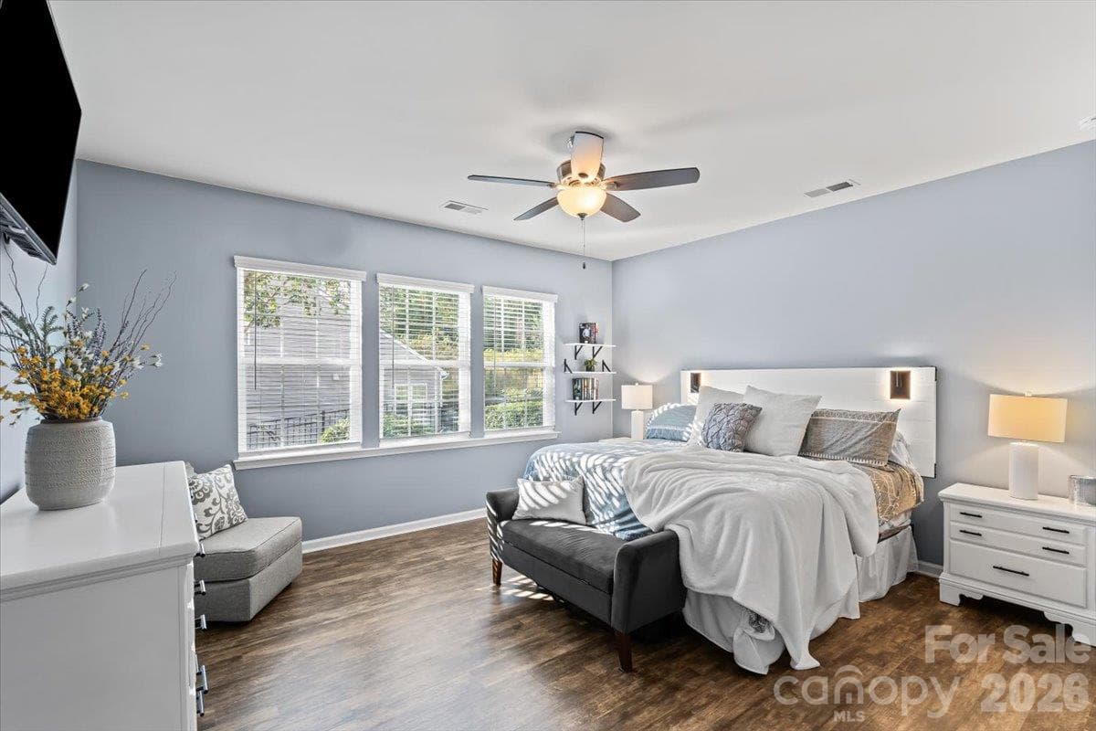 Primary suite on the main level, privately tucked away at the rear of the home. - 2003 Harvest Time Lane, Waxhaw