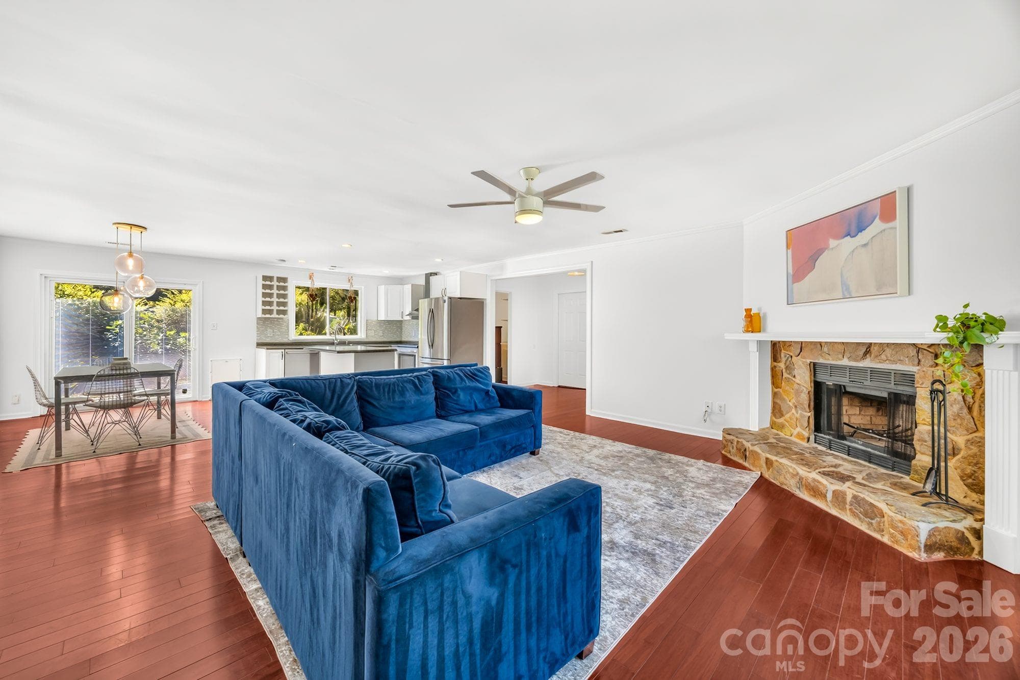 Open living and dining area, all on one level, in this 3-bedroom, 2-bath ranch in Vernedale Farms, Charlotte - 4900 Cricklewood Lane, Charlotte