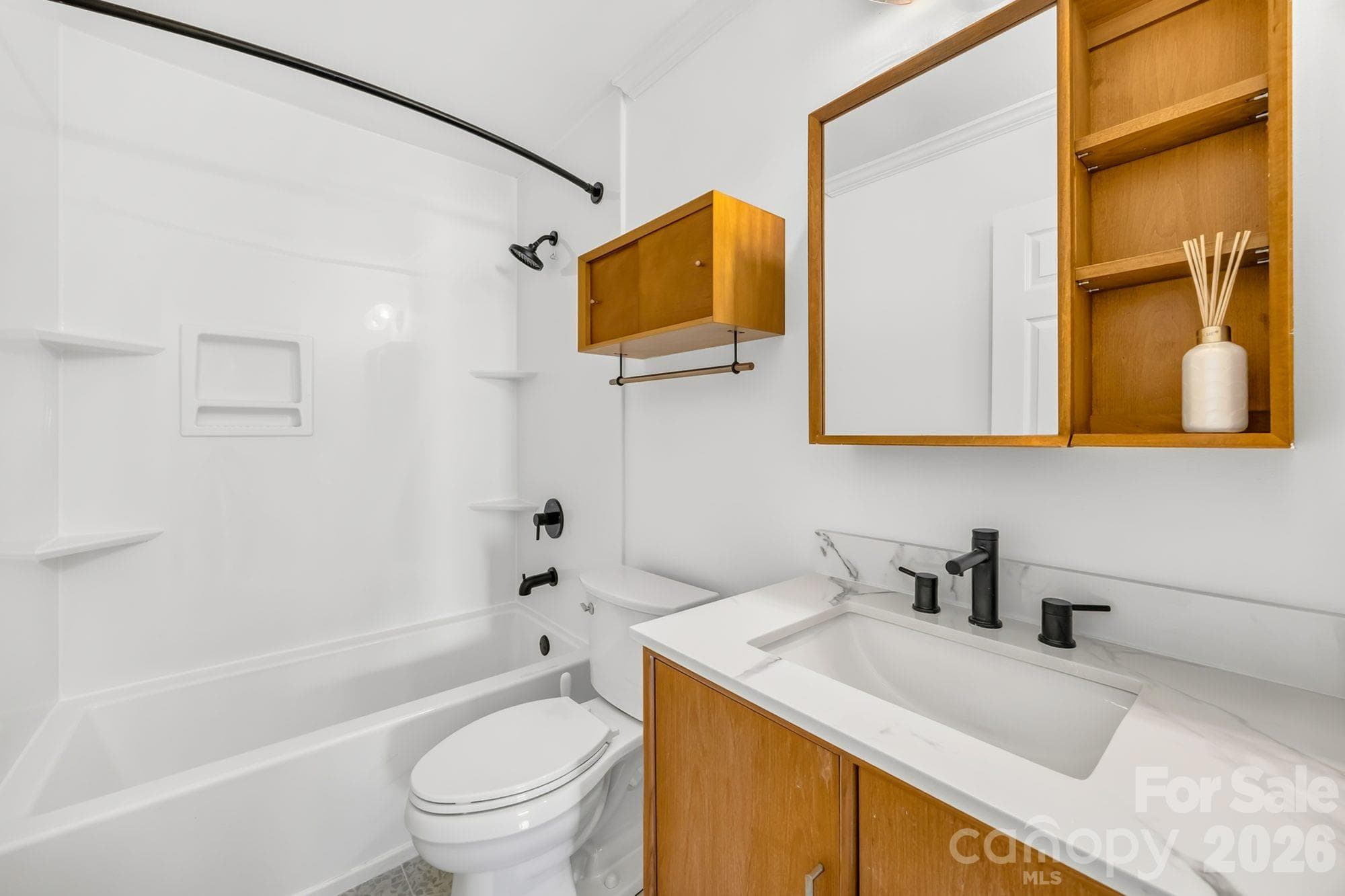 Second full bathroom with tub/shower combo and updated vanity, remodeled in 2022 - 4900 Cricklewood Lane, Charlotte