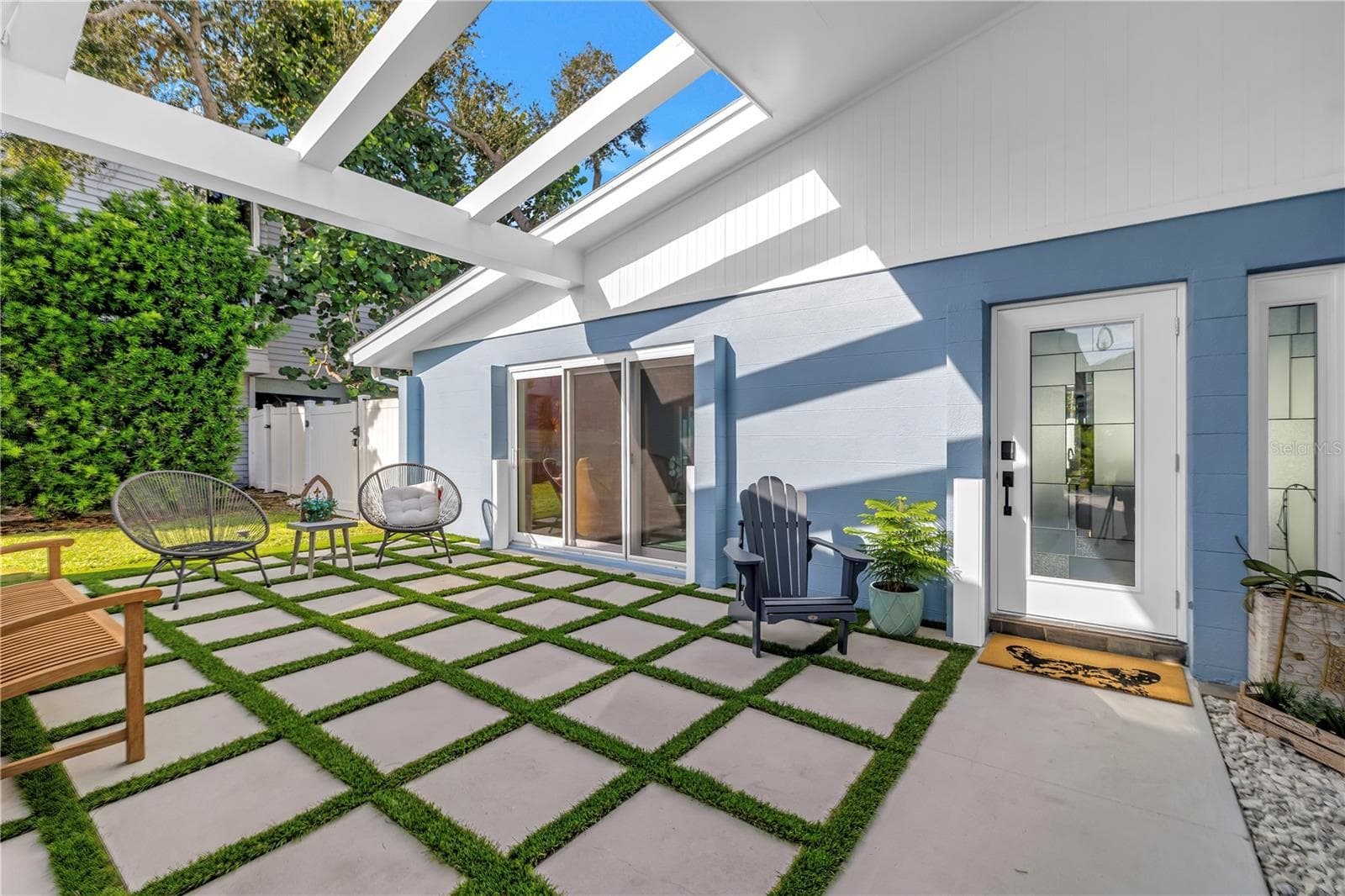 Mid century modern architecture weclomes you and guests in your front courtyard. - 1114 2ND AVE S, TIERRA VERDE