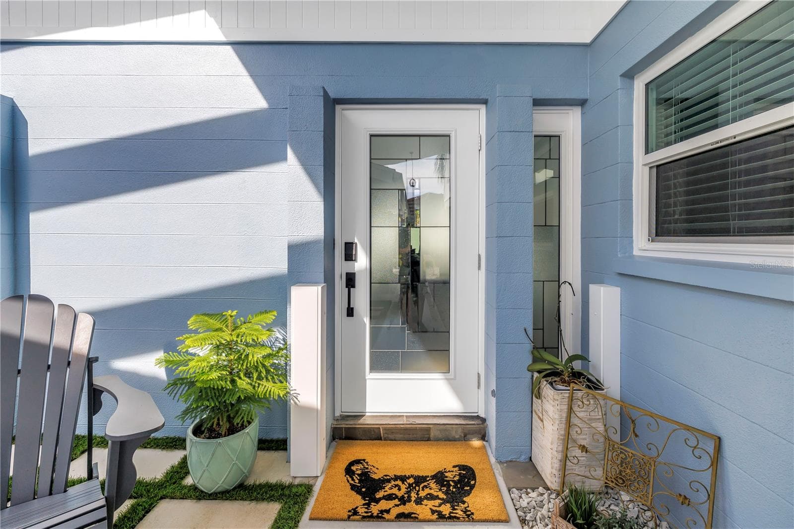 Fido says welcome home! Custom front door with inlaid glass and glass side panel. - 1114 2ND AVE S, TIERRA VERDE