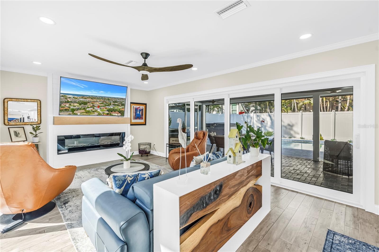 Welcome in to rooms bathed in sunlight with panoramic views of the outdoors. - 1114 2ND AVE S, TIERRA VERDE